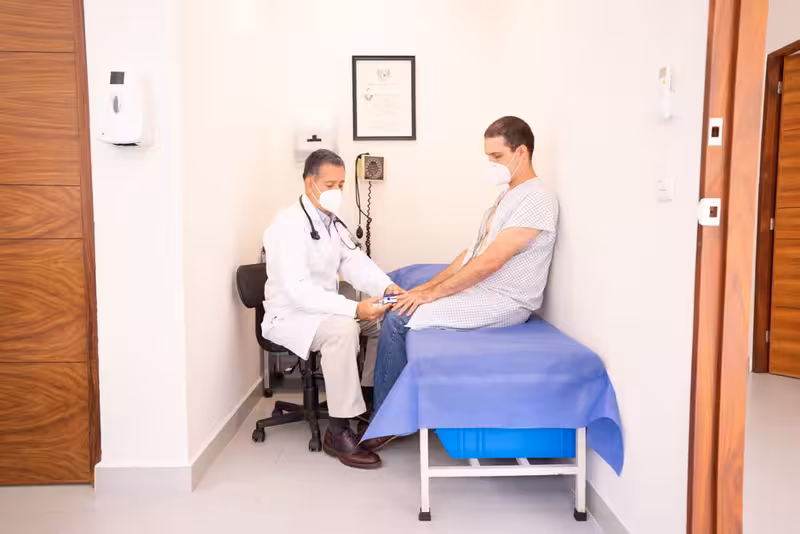 Answers to Common Questions About Colindale Ear Wax Removal: A doctor and patient during a consultation Doctor and patient consultation for Answers to Common Questions About Colindale Ear Wax Removal - Colindale: Private Microsu...